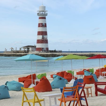 Colourful seating in front of the light house in Ocean Cay | 600 x 600