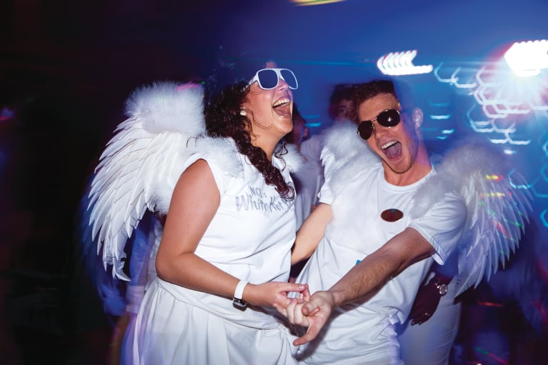 Crew members from NCL's entertainment staff having a blast at a white party. A perfect first job on a cruise ship for those starting out!