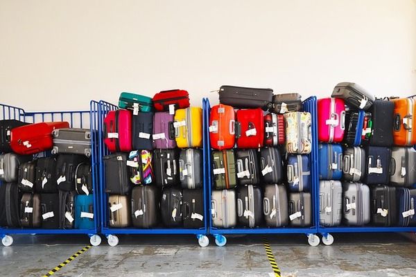 Cruise passengers luggage on trolley during embarkation | by Tony Prats 600x400