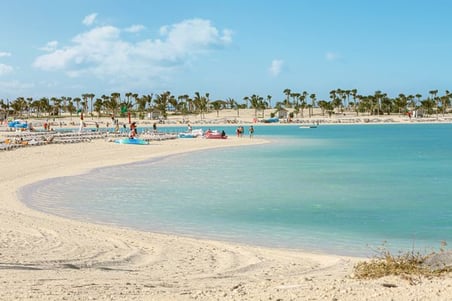 Passengers lounging on the beach | Ocean Cay | 600 x 400