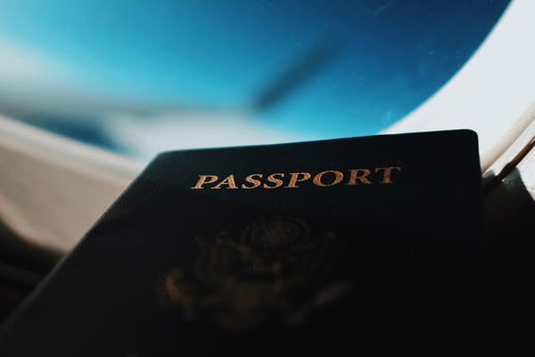 Passport in front of a porthole | by Agus Dietrich 600x400