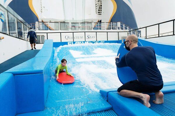 Mask wearing is compulsory across the full Royal fleet, even during water activities like here on Quantum of the Seas during waterboarding.