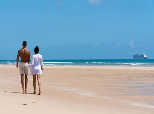 MSC | couple walking on Portuguese Islands with the MSC Orchestra in the background on a cruise from Durban South Africa