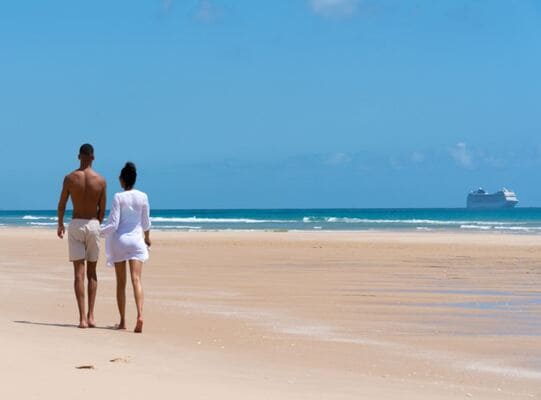 Passengers walking on the beach on their Portuguese Island cruise onboard the MSC Cruises - MSC Musica