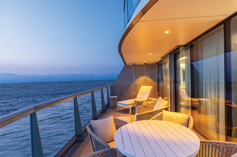 Royal Suite's private veranda onboard Silversea Cruises offers stunning views of the open sea, complete with luxurious amenities and top-notch service