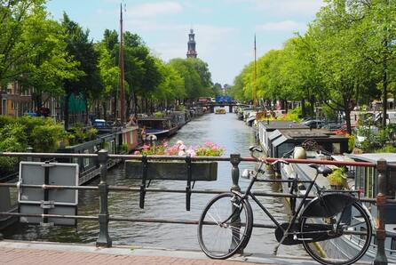 Bicycle in front of Canal in Amsterdam, Netherlands | Callum Parker
